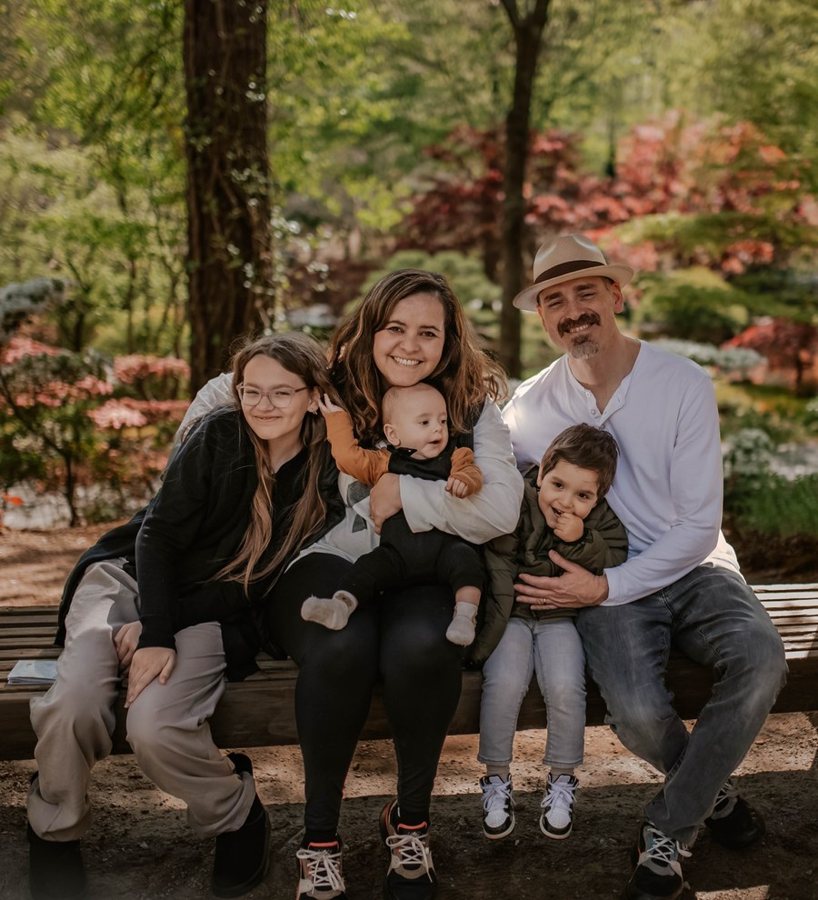 Zaidi with her husband and their three children in a garden